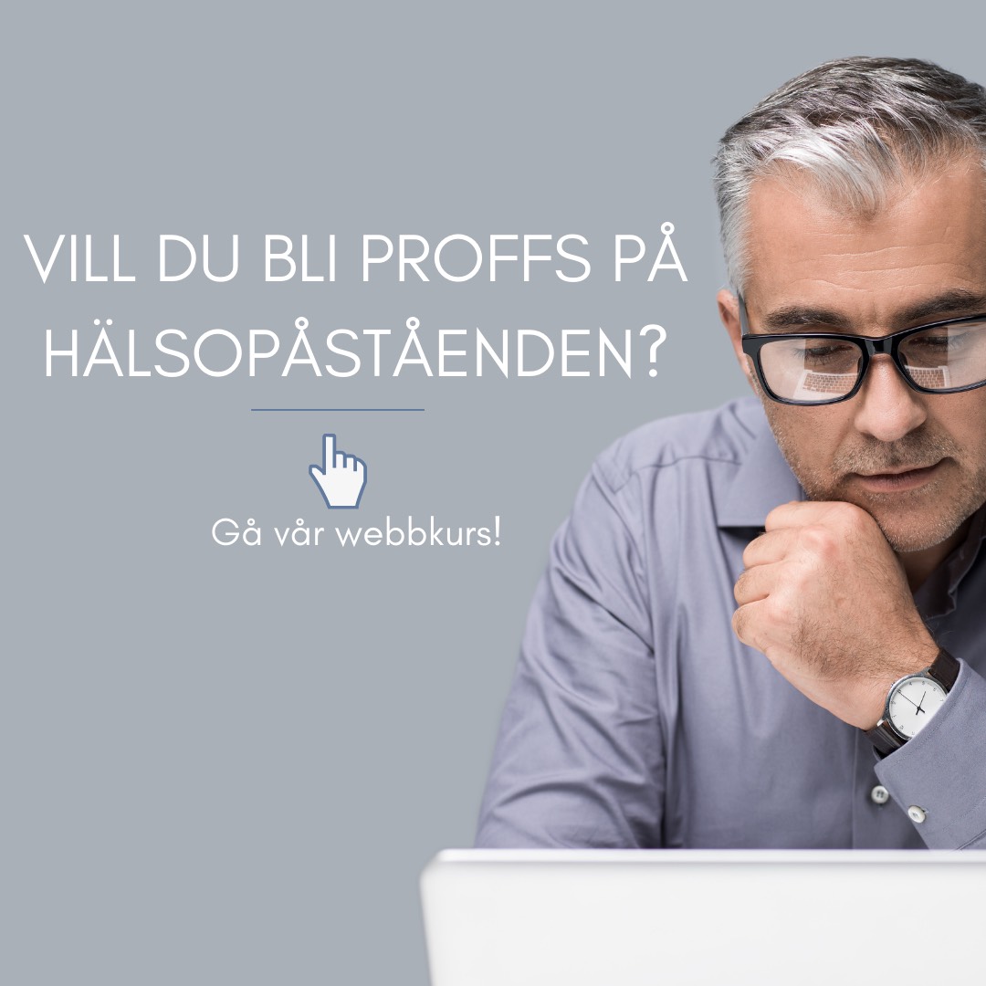 Man med glasögon studerar vid en dator